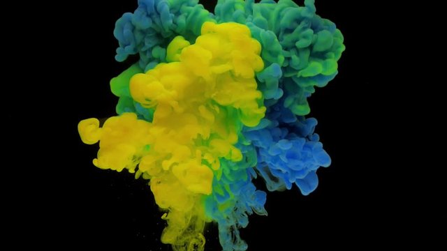 Colorful blue and yellow ink rise up in the water and mixing, swirling softly underwater on black background. Acrylic cloud of paint isolated. Abstract smoke explosion animation. Timelapse Slow motion