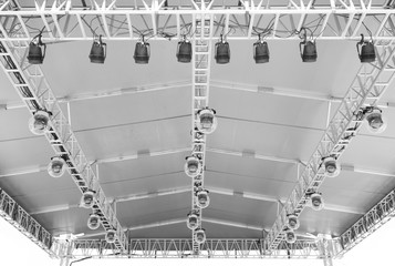 Detailed covered stage light and effect scaffolding. Outdoor stage audio visual design and detail. 
