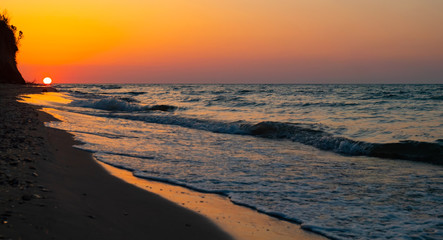 Fototapeta na wymiar Sunrise over the sea morning beach