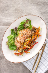 Crystal Noodles with fried Beef and vegetables on white plate on fabric background