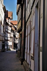 Fototapeta na wymiar Narrow street with crooked houses in the old town of Hann. Munden