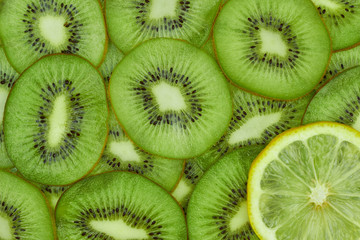 One lemon slice on kiwi background, top view, flat lay. Not like others concept.