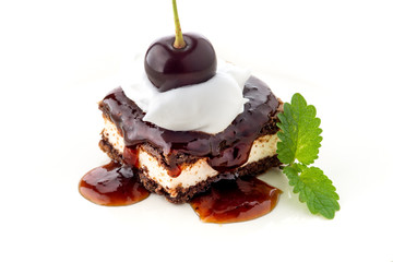waffle cake with cherry and whipped cream with mint leaf isolated on white