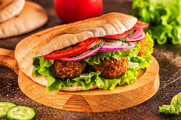 Falafel and fresh vegetables in pita bread.