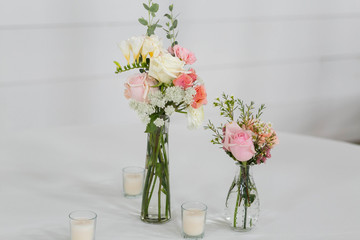 Fresh Flowers in Vase on Table, Wedding Floral Arrangment at Reception, Roses and Peonies in Glass Jars, White Background, Modern Barn Wedding