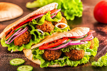 Falafel and fresh vegetables in pita bread.