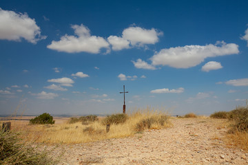 iron cross against the cloudscape