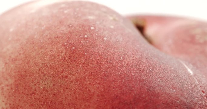 Donut peach isolated rotates on itself on white background. Snuffbox, Saturn, Tabacchiera rotation. Organic fruit.