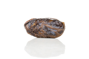 One whole dried brown date medjool isolated on white background