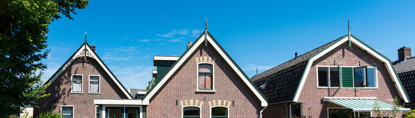 Facade of small houses in Broek op Langedijk, The Netherlands