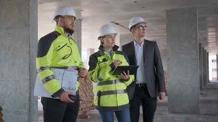 Architect or engineer working, browsing building project indoor of construction site with blueprint plan. businessman worker, man male construction engineers or architects working people. Engineer In