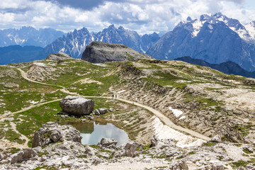 clouds over mountain trail in Dolomites