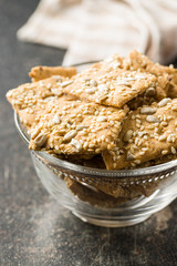 Salted crispy crackers with sesame and sunflower seeds
