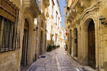 Fototapeta na wymiar Narrow Charming Street in Senglea, Malta.