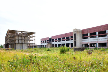 Fototapeta na wymiar Large abandoned industrial building, unfinished factory