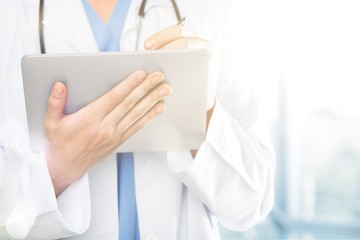 Close-up Doctor at hospital working with tablet pc