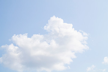 white clouds against the blue sky.