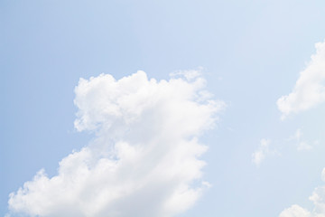 white clouds against the blue sky.