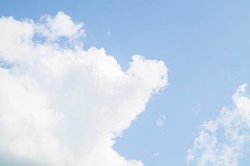 white clouds against the blue sky.