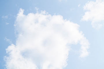 white clouds against the blue sky.