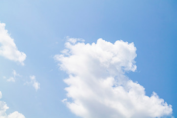 Naklejka na ściany i meble white clouds against the blue sky.