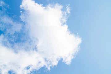 white clouds against the blue sky.