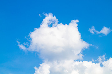 white clouds against the blue sky.