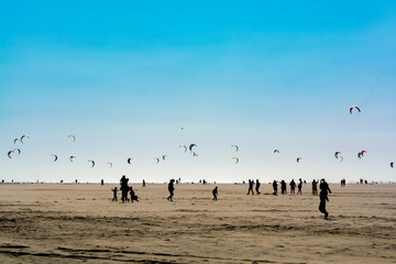 Water sport event, kite surfers race in North Sea near Renesse, Zeeland, Netherlands