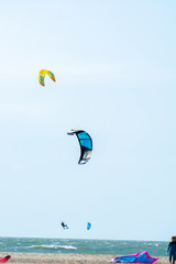 Water sport event, kite surfers race in North Sea near Renesse, Zeeland, Netherlands