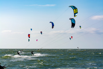 Water sport event, kite surfers race in North Sea near Renesse, Zeeland, Netherlands