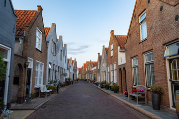 Street view in small Dutch town Goedereede on sunset, Zeeland, Netherlands