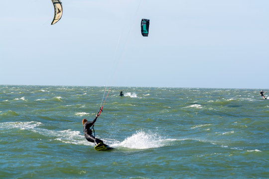 Water sport event, kite surfers race in North Sea near Renesse, Zeeland, Netherlands