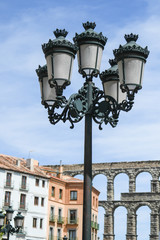 Fototapeta na wymiar Streetlight in the foreground, with Segovia aqueduct in the background