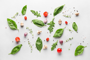 Fresh herbs with vegetables, mushrooms and spices on white background