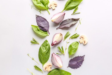 Fresh herbs with mushrooms and onion on white background
