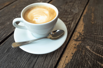 cup of coffee on wooden table