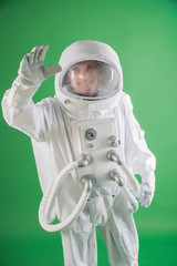 astronaut in spacesuit waving his hand © de Art