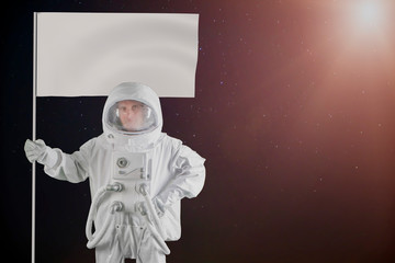 astronaut with flag empty white banner in hand