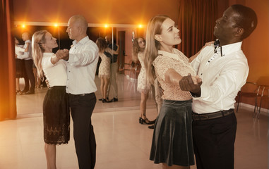 People learning to dance waltz