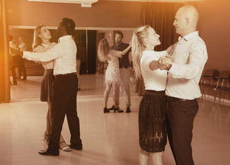 Young people learning to technique of classical dance in dancing class