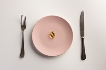 Omega 3 capsules on a plate. Flat lay.