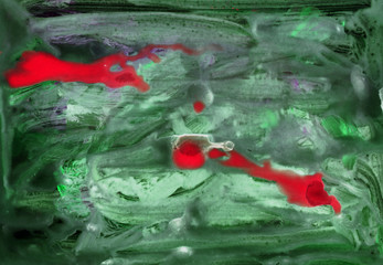 Green and red watercolor splash background. Paint stains with spots, blots, grains, splashes. Colorful wallpaper.