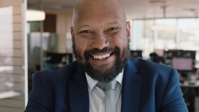 portrait african american businessman smiling confident manager in corporate office attractive male executive enjoying successful career in business management professional at work