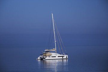 Fototapeta premium beautiful yacht on a background of sea sunset, concept of expensive luxury vacation.