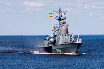 A line ahead of modern russian military naval battleships warships in the row, northern fleet and baltic sea fleet, summer sunny day