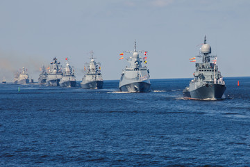 A line ahead of modern russian military naval battleships warships in the row, northern fleet and...
