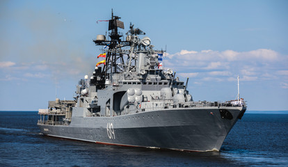 A line ahead of modern russian military naval battleships warships in the row, northern fleet and baltic sea fleet, summer sunny day