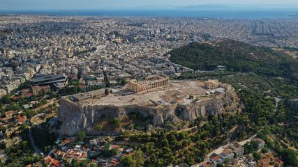 Fototapeta na wymiar Aerial drone photo of iconic Plaka and Monastiraki districts and iconic Acropolis hill with masterpiece of Western Ancient world the Parthenon, Athens historic centre, Attica, Greece