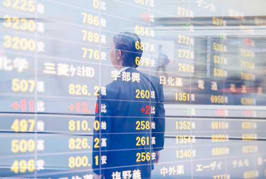 Reflection Of Businessman On Stock Exchange Information Board