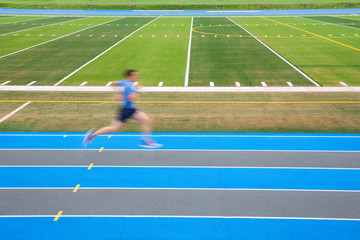 Side view of man running on track